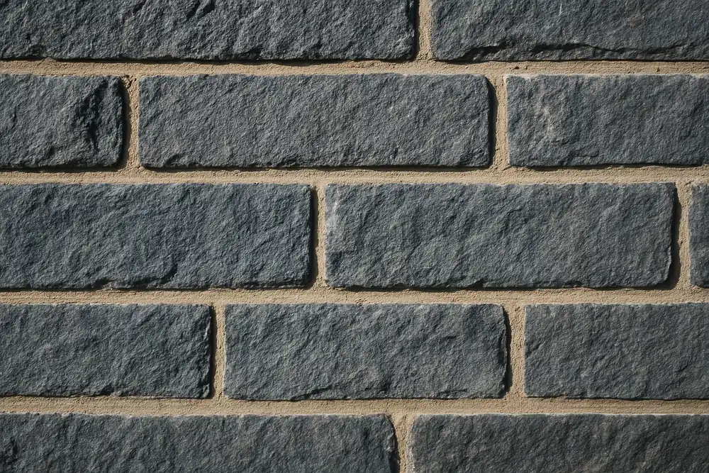 Neat lined pointing between coursed bluestone — heritage masonry repair, Adelaide. Illustrative example.
